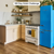 Golden Danish Oak LLP359 floors in a motel kitchen with an electric blue fridge designed by Brian Kleinschmidt in 100 Day Hotel Challenge