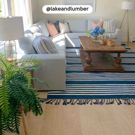 Living room with Washed Butternut RKP8108 floors; photo credit: @lakeandlumber